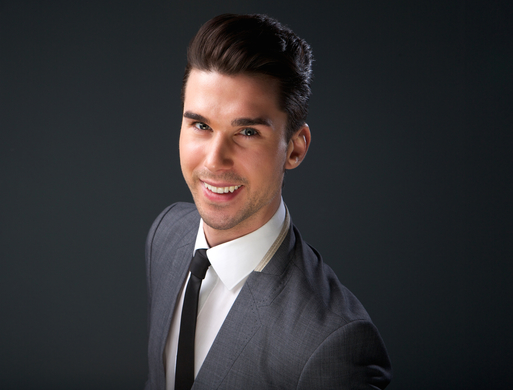  Close up portrait of a cool young guy smiling in business suit and necktie